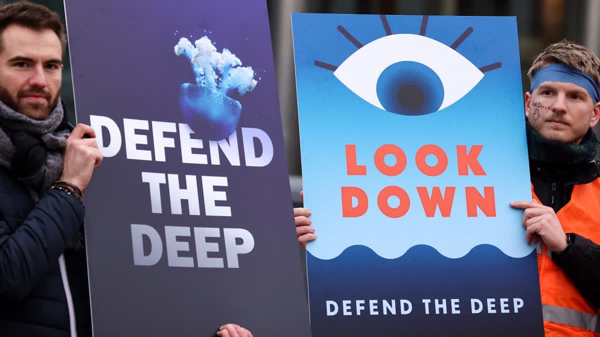 Activists take part at a "Look Down action" rally to stop deep sea mining